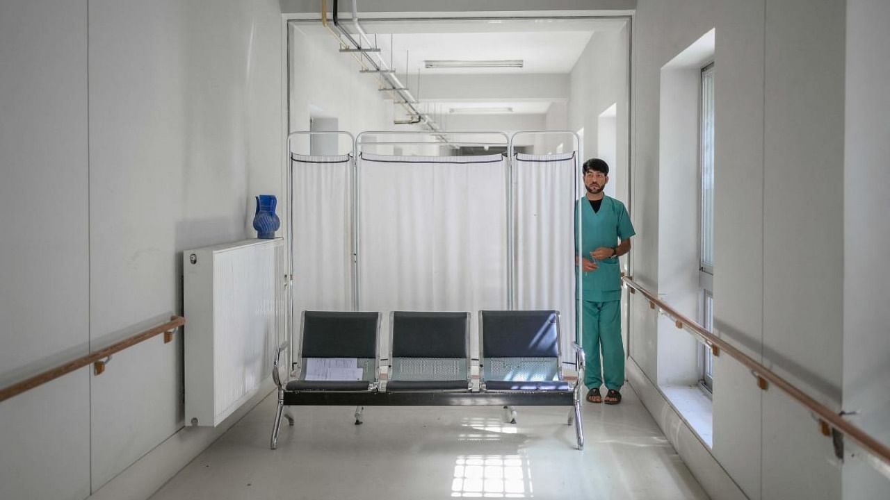 A health worker walking inside the Afghan Japan Covid-19 hospital in Kabul. Credit: AFP File Photo