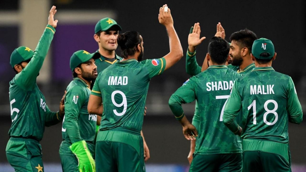 Pakistan's players celebrate after the dismissal of Afghanistan's Asghar Afghan (not pictured) during the ICC men’s Twenty20 World Cup cricket match between Afghanistan and Pakistan at the Dubai. Credit: AFP Photo