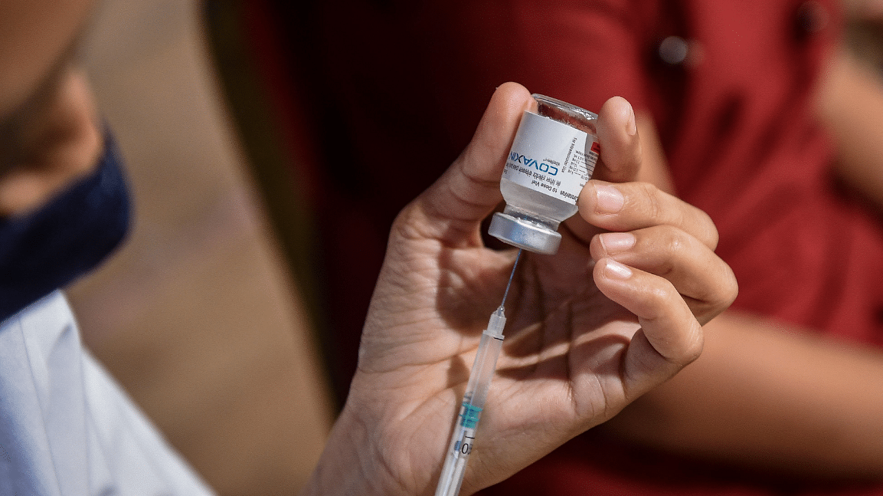 A health worker prepares a jab of the Covaxin vaccine against the Covid-19 coronavirus during a vaccination camp. Credi: AFP Photo
