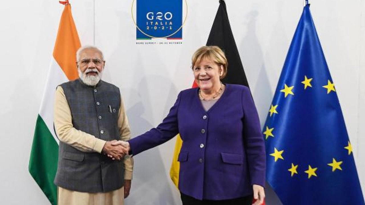 Prime Minister Narendra Modi with German Chancellor Anjela Merkel, in Rome. Credit: PTI Photo