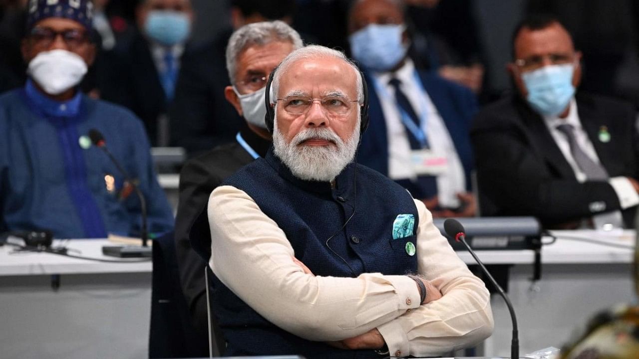 Prime Minister Narendra Modi listens to a speaker during the opening ceremony of the COP26 UN Climate Change Conference in Glasgow. Credit: AFP Photo
