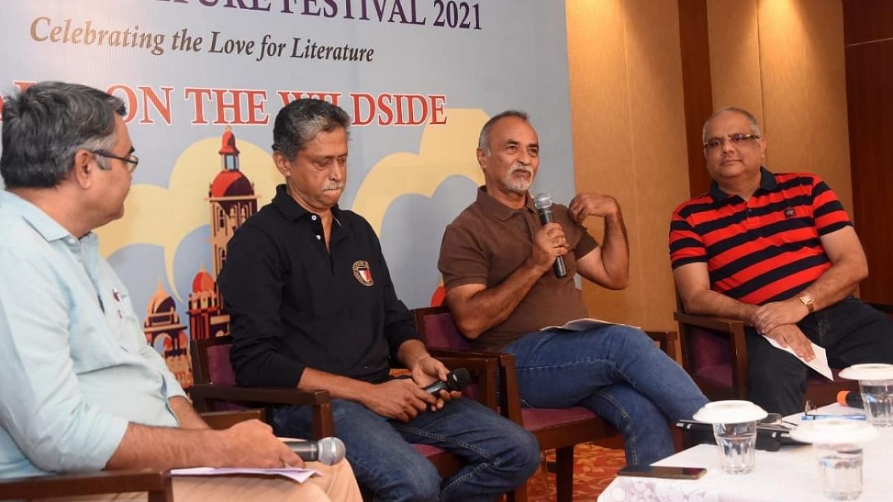 Panelists B S Dinesh and Chaduranga Kanthraj Urs participate with wildlife photographers and conservationists B S Krupakar and Senani Hegde in a session as part of the fifth edition of Mysuru Literature Festival. Credit: DH Photo