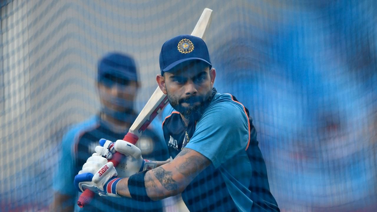 India's captain Virat Kohli warms up before the start of the ICC men’s Twenty20 World Cup cricket match between India and New Zealand at the Dubai International Cricket Stadium in Dubai on October 31, 2021. Credit: AFP Photo