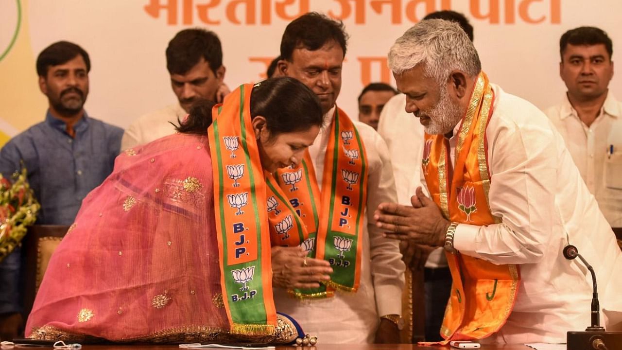 Samajwadi Party MLA Subhash Pasi with his wife Rina Pasi join BJP in presence of State President Swatantra Dev Singh at party office in Lucknow. Credit: PTI Photo