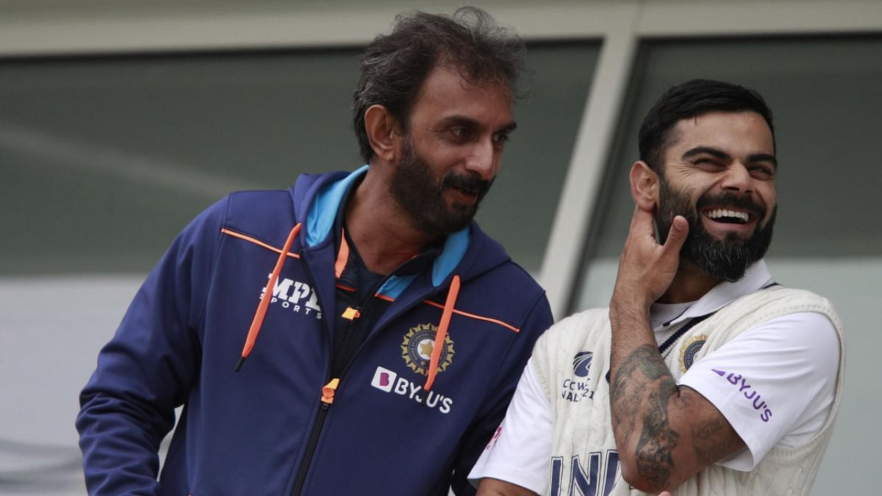 Batting coach Vikram Rathour with Virat Kohli. Credit: AP File Photo