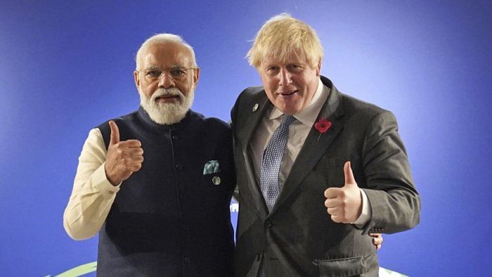 India's Prime Minister Narendra Modi and Britain's Prime Minister Boris Johnson. Credit: AP Photo