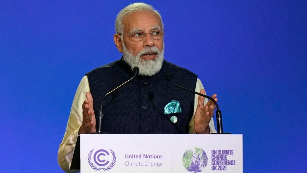 Prime Minister Narendra Modi presents his national statement as part of the World Leaders' Summit of the COP26 UN Climate Change Conference in Glasgow. Credit: AFP Photo