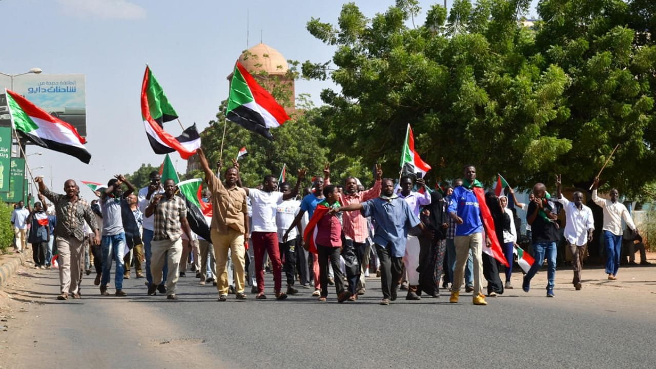 Sudanese anti-coup protesters attend a gathering in the capital Khartoum's twin city of Omdurman on October 30, 2021, to express their support for the country's democratic transition. Credit: AFP Photo