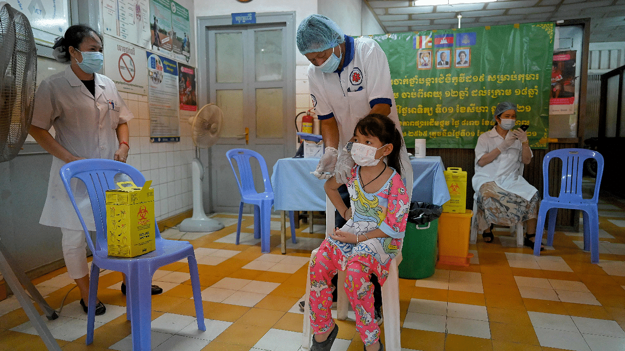 A girl receives a dose of the Sinovac Covid-19 coronavirus vaccine at a health centre in Phnom Penh. Credit: AFP Photo