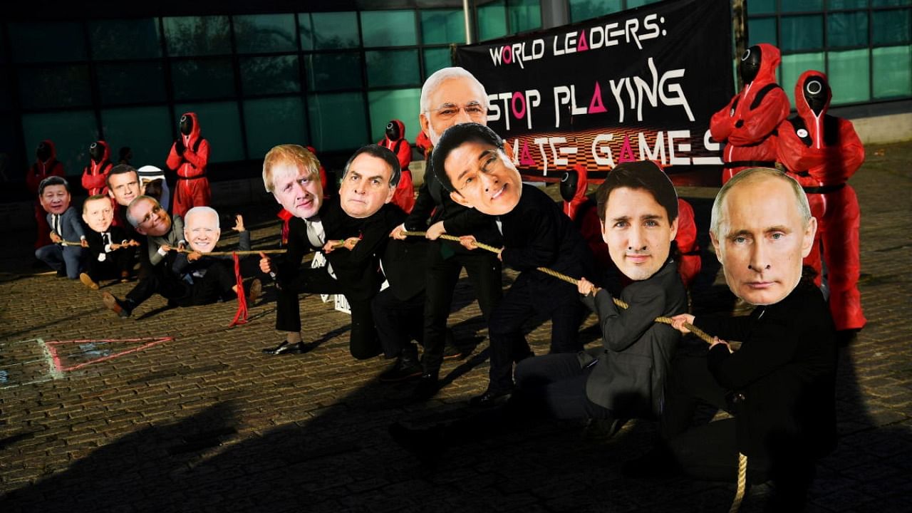 Climate activists dressed as world leaders take part in a "Squid Games" inspired protest during the UN Climate Change Conference (COP26) in Glasgow. Credit: Reuters photo