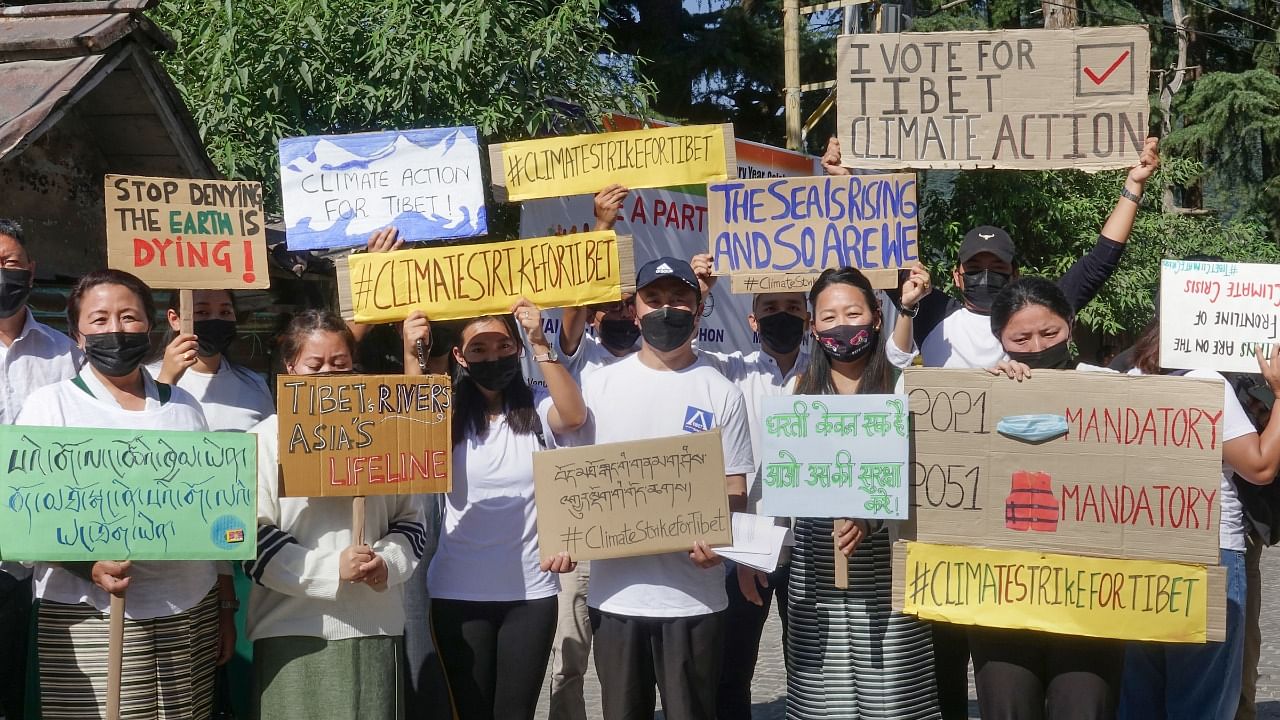 Tibetans participate in a protest to highlight environmental issues in Tibet ahead of the COP26 summit, in Dharamshala. Credit: PTI File Photo