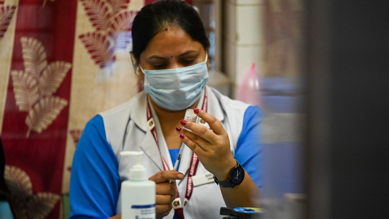 A health worker inoculates prepares a dose of the Covaxin vaccine against the Covid-19 coronavirus at a health centre in New Delhi on October 21, 2021. Credit: AFP File Photo