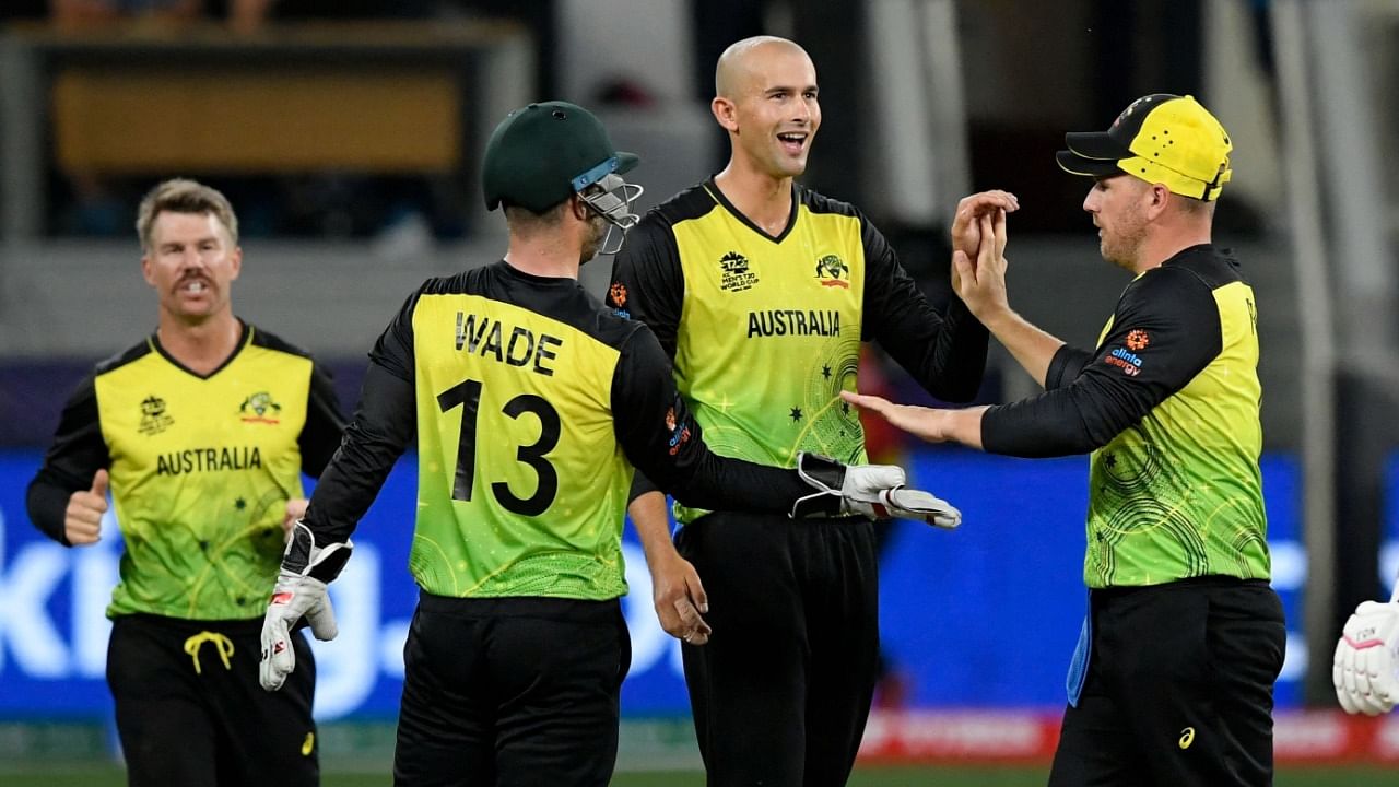 Australian players celebrate after the dismissal of England's Dawid Malan during their previous T20 World Cup match. Credit: AFP File Photo