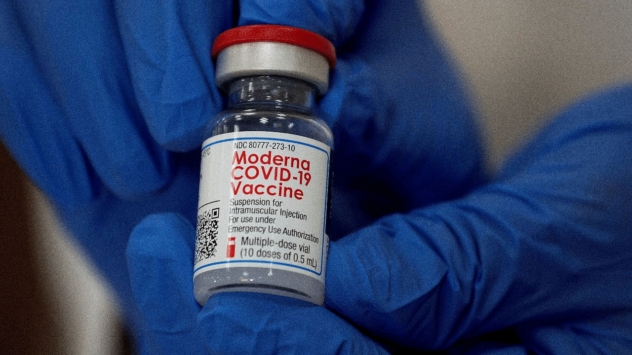 An employee shows the Moderna Covid-19 vaccine. Credit: Reuters Photo