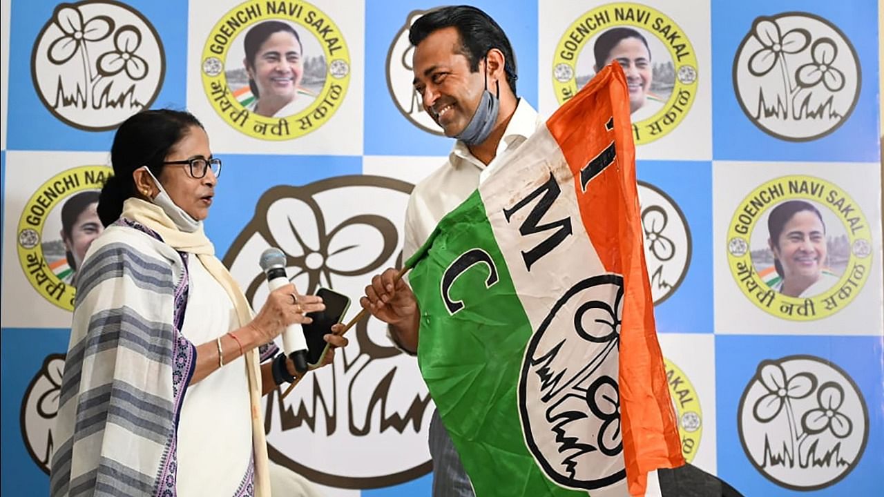 West Bengal CM and TMC Supremo Mamata Banerjee offers party flag to Tennis veteran Leander Paes as he joins the party, in Panaji, Friday, October 29, 2021. Credit: PTI File Photo