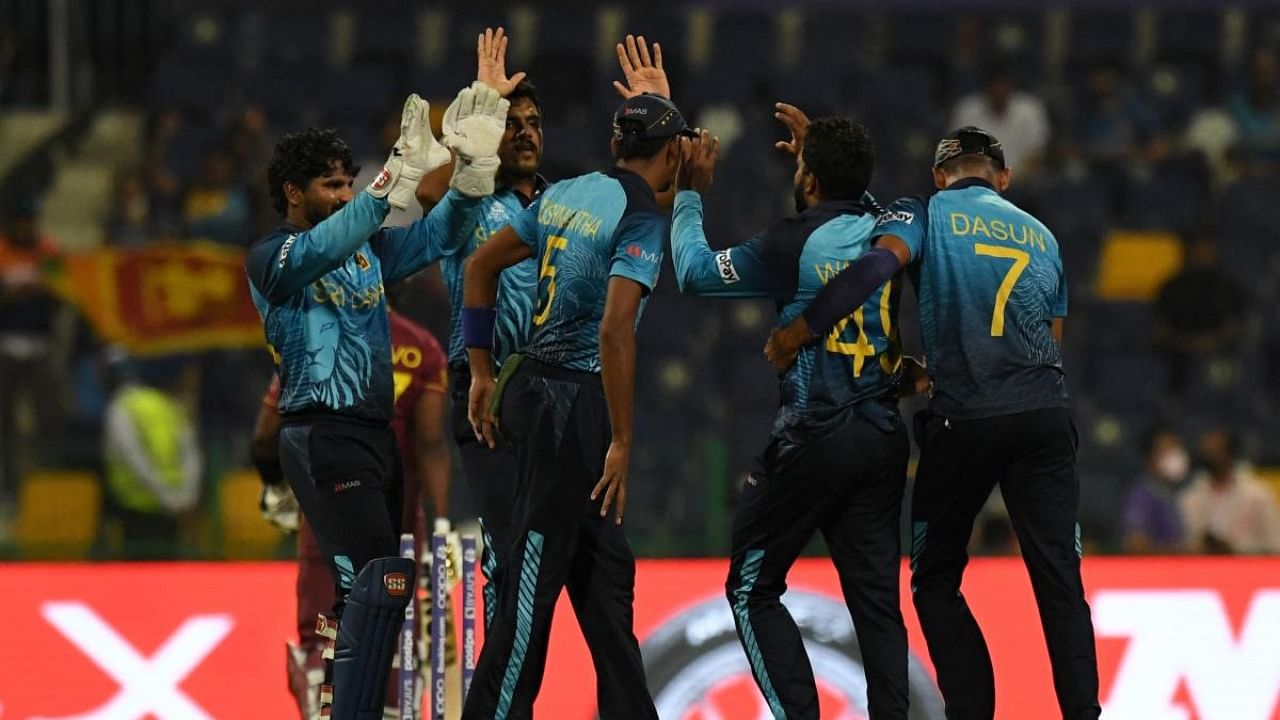 Sri Lanka's cricketers celebrates after the dismissal of West Indies' Dwayne Bravo during the ICC men’s Twenty20 World Cup cricket match between West Indies and Sri Lanka at the Sheikh Zayed Cricket Stadium in Abu Dhabi. Credit: AFP Photo