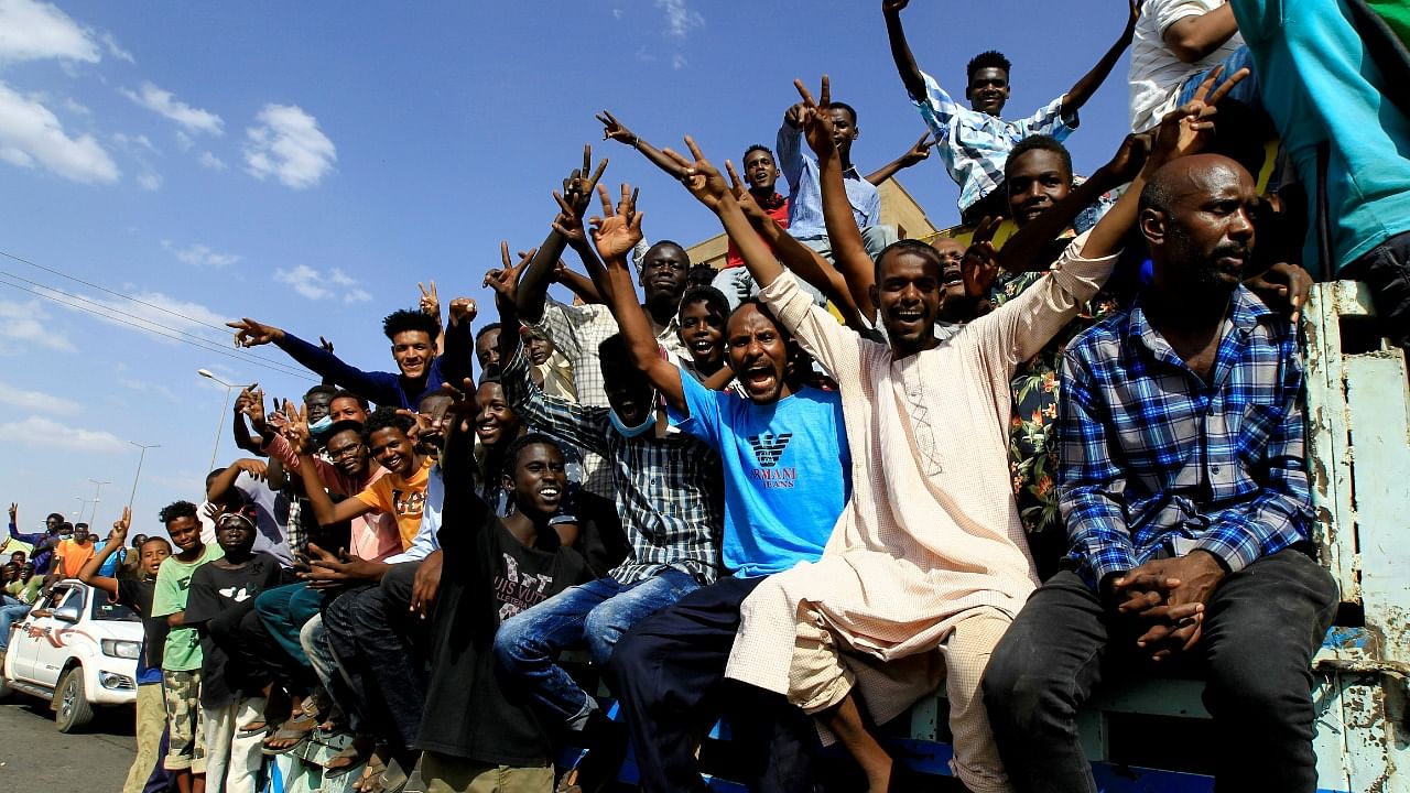 Protesters gesture and shout slogans as they demonstrate against the Sudanese military's recent seizure of power and ousting of the civilian government. Credit: Reuters Photo