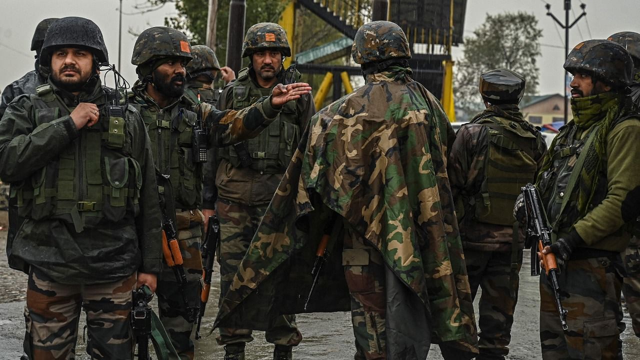 Indian army soldiers stand guard during a search operation reportedly conducted after a tip-off about the presence of suspected militants in Bemina area of Srinagar. Credit: AFP Photo