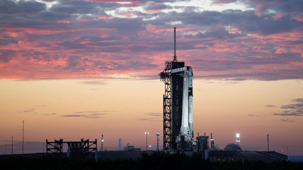 This NASA photo shows SpaceX Falcon 9 rocket with the company's Crew Dragon spacecraft onboard at sunset on the launch pad at Launch Complex 39A as preparations continue for the Crew-3 mission, October 27, 2021, at NASA’s Kennedy Space Center in Florida. Credit: AFP Photo/NASA/Joel Kowsky