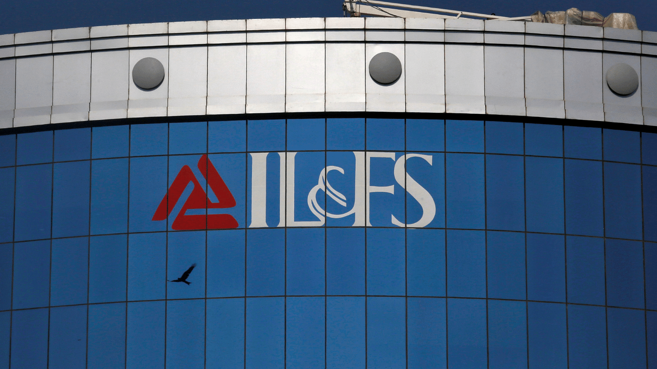 A bird flies next to the logo of IL&FS (Infrastructure Leasing and Financial Services Ltd.). Credit: Reuters Photo