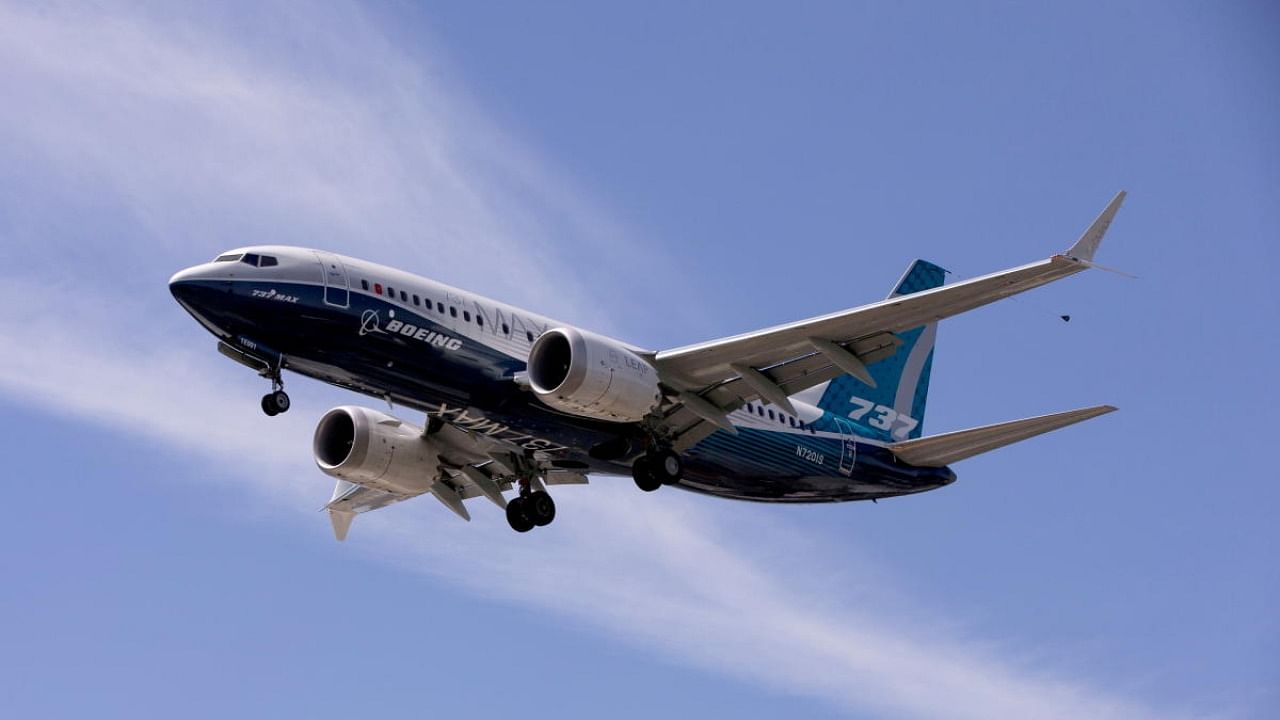 A Boeing 737 MAX airplane lands after a test flight at Boeing Field in Seattle. Credit: Reuters file photo