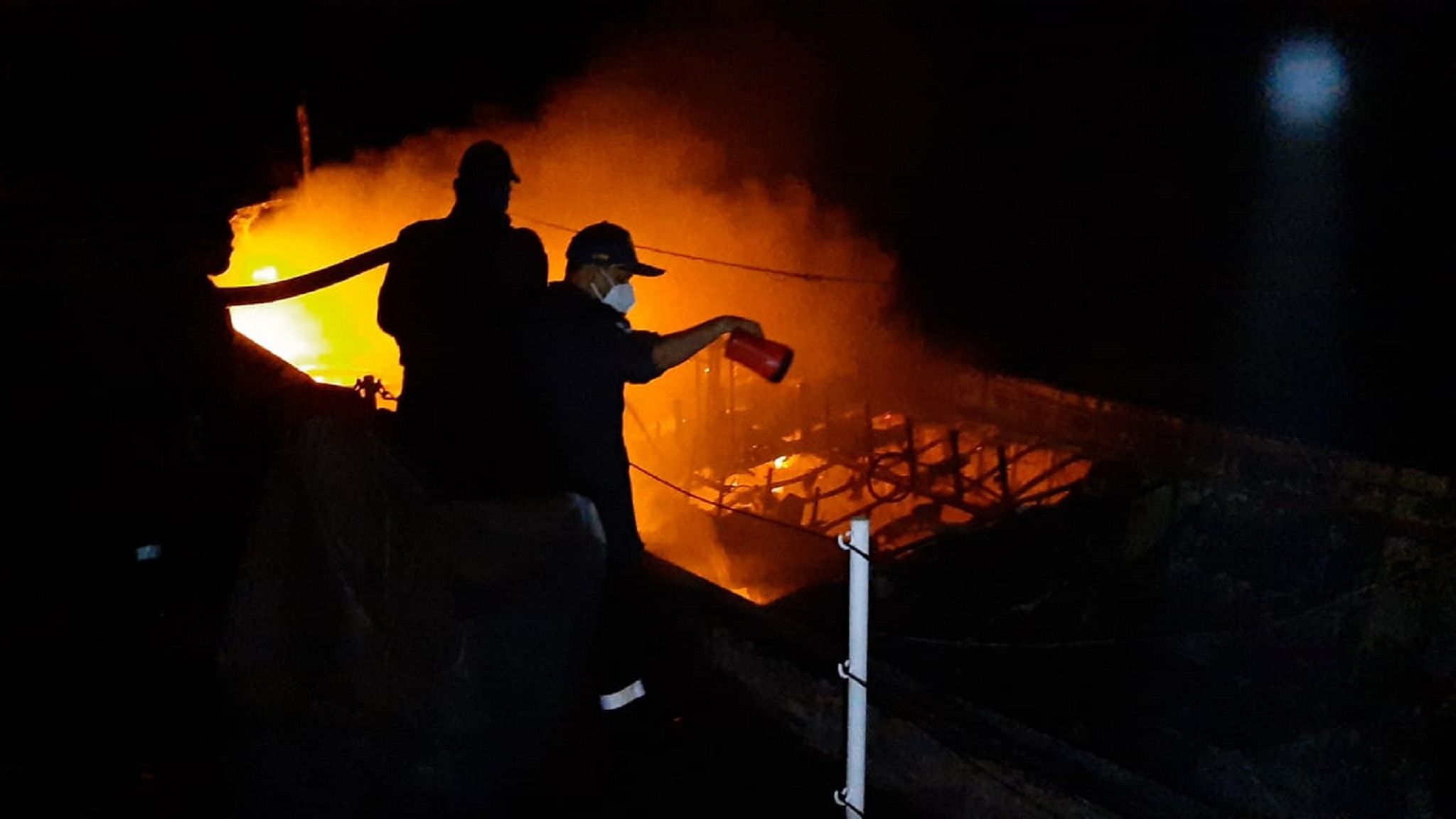 Indian Coast Guard douse fire in a fishing boat. Credit: Special arrangement