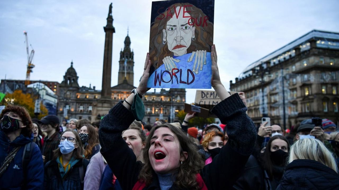 People take part in a Fridays for Future protest during the UN Climate Change Conference (COP26), in Glasgow. Credit: AFP Photo