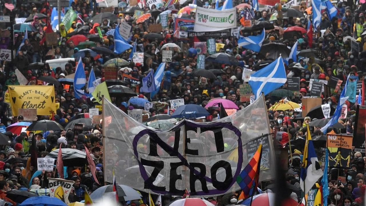 People participate in a protest rally during a global day of action on climate change in Glasgow. Credit: AFP Photo