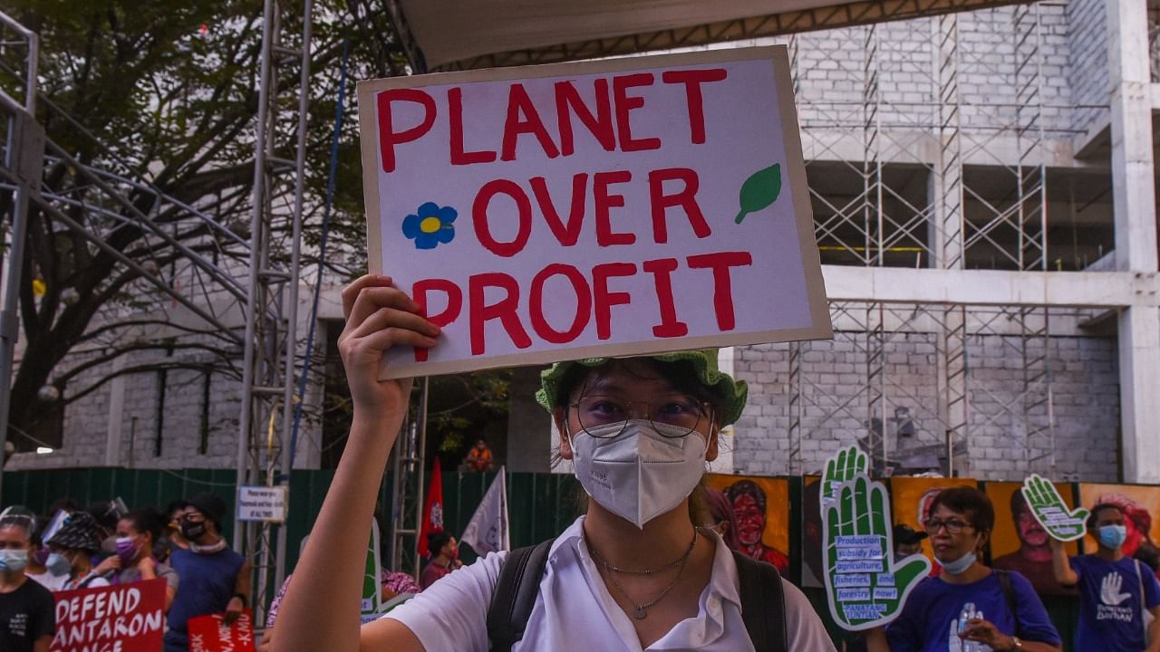 People participate in a rally during a global day of action on climate change in Manila. Credit: AFP Photo