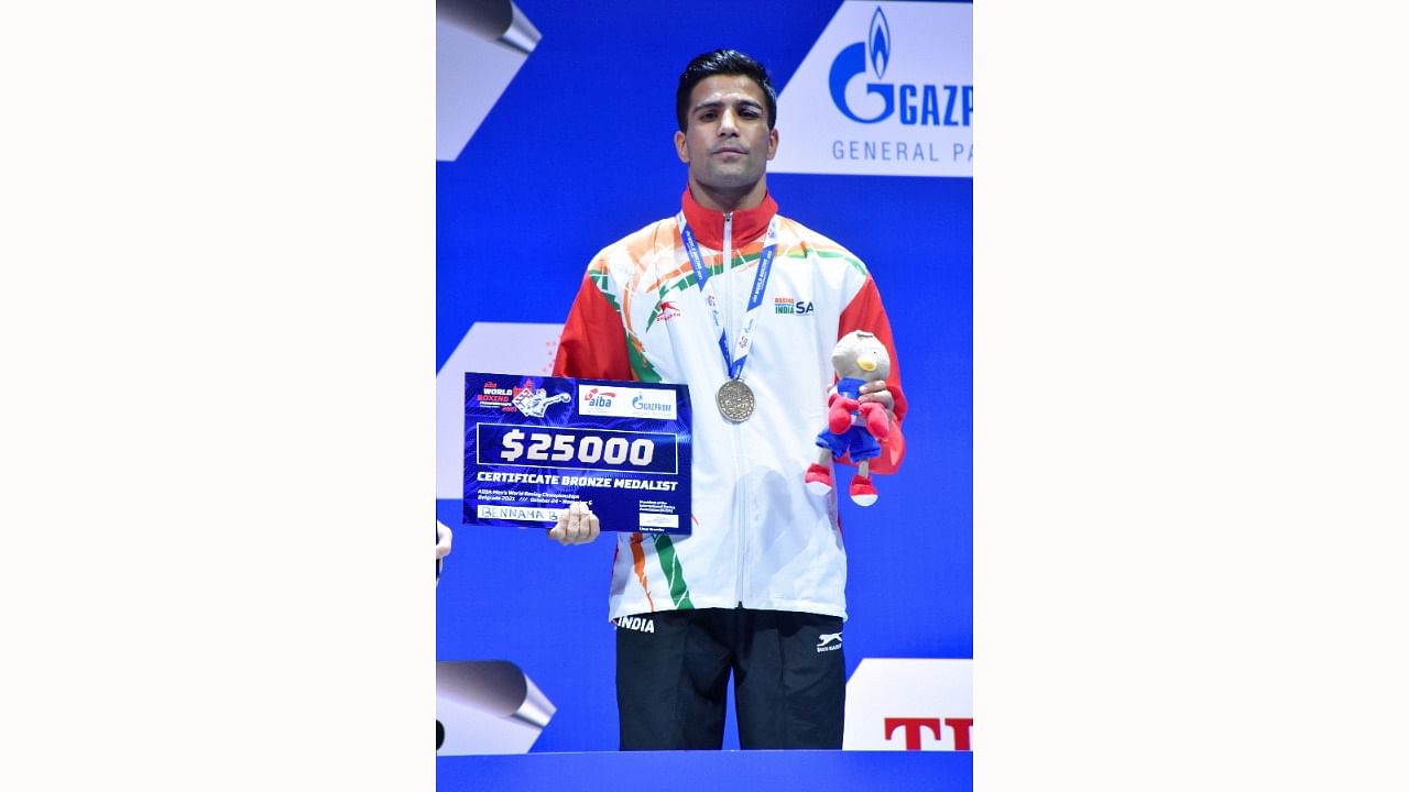 India's Akash Kumar during the medal ceremony at the 2021 AIBA Men's World Boxing Championships. Credit: PTI Photo
