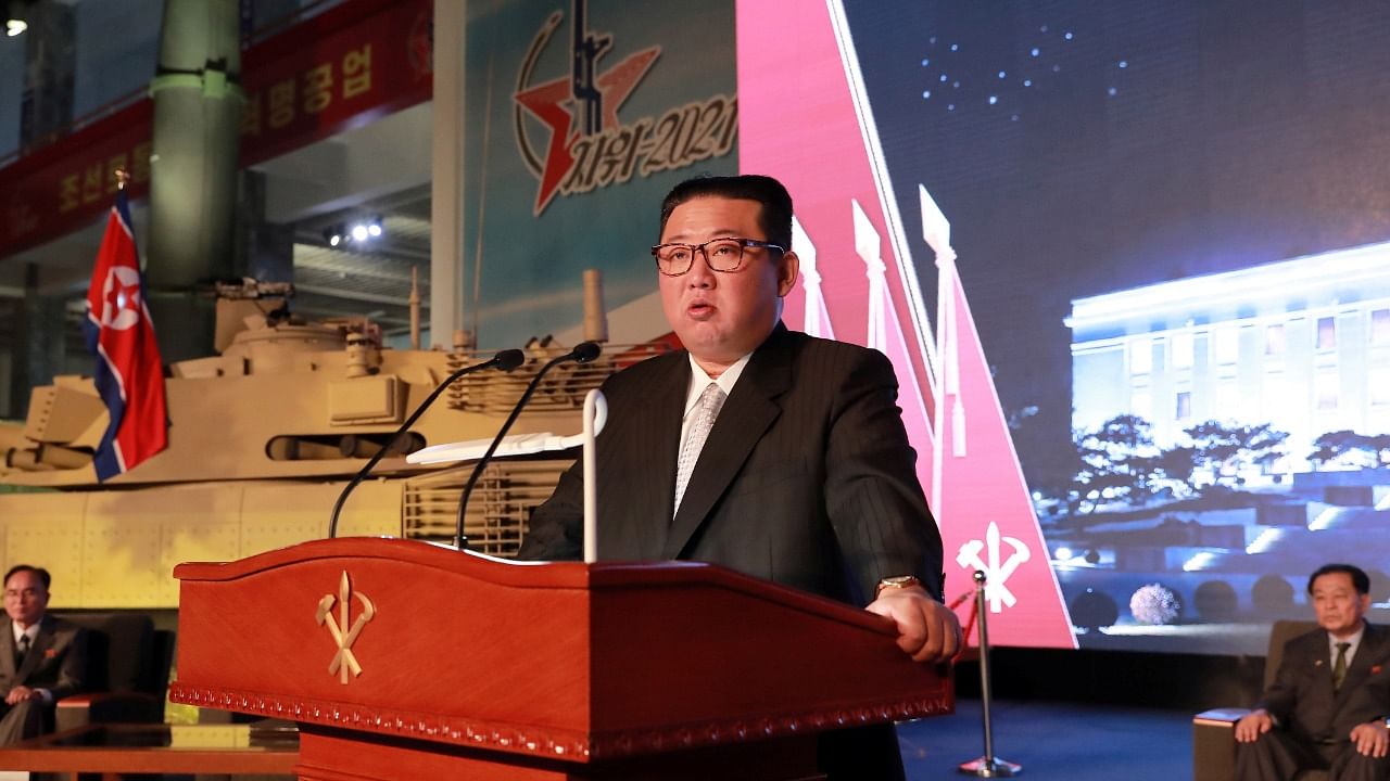 North Korea's leader Kim Jong Un speaks at the Defence Development Exhibition, in Pyongyang, North Korea, in this undated photo released on October 12, 2021 by North Korea's Korean Central News Agency (KCNA). Credit: KCNA via Reuters