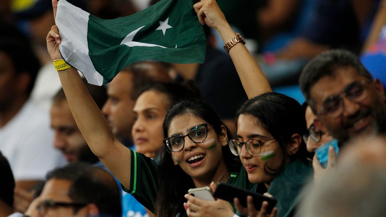 Pakistan fans celebrate after Babar Azam hits a six. Representative Image. Credit: Reuters File Photo
