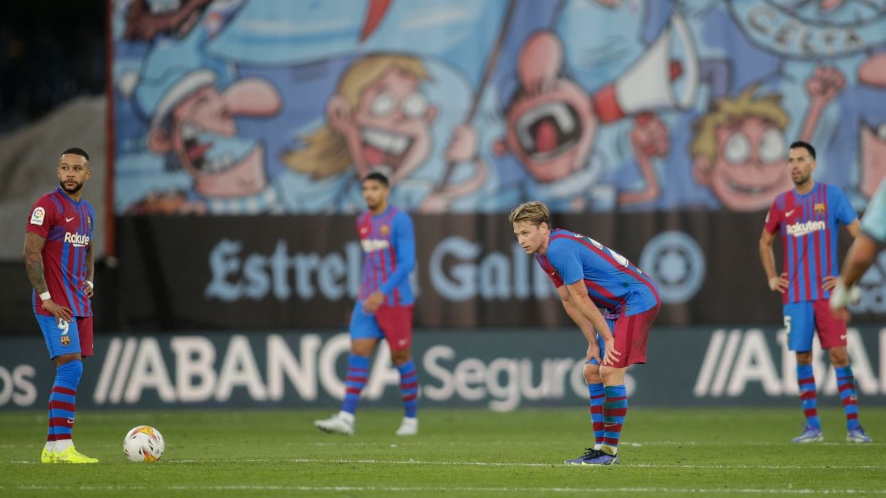 FC Barcelona's Frenkie de Jong and Memphis Depay look dejected after conceding a three-goal lead in their 3-3 draw to Celta Vigo in La Liga. Credit: Reuters Photo