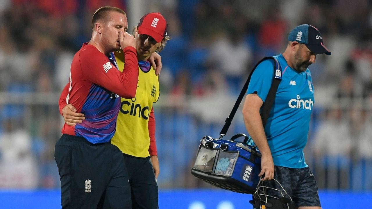 England's Jason Roy (L) walks off the field after a injury during the ICC men’s T20 World Cup match against South Africa at the Sharjah Cricket Stadium in Sharjah. Credit: AFP Photo