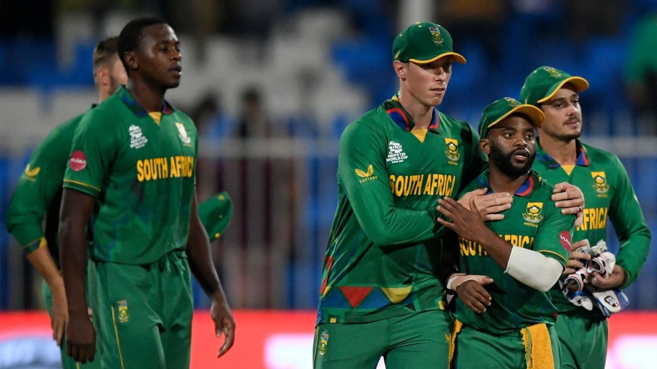 South African players celebrate their win over England in the ICC men’s T20 World Cup at the Sharjah Cricket Stadium in Sharjah. Credit: AFP Photo