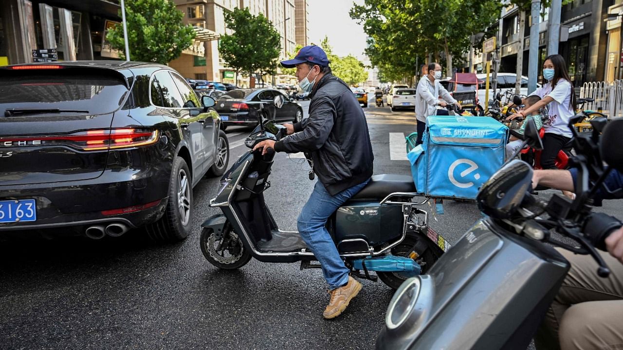 Authorities have launched a crackdown demanding delivery firms ensure basic labour protections such as proper compensation, insurance, as well as tackling algorithms that effectively encourage dangerous driving. Credit: AFP File Photo