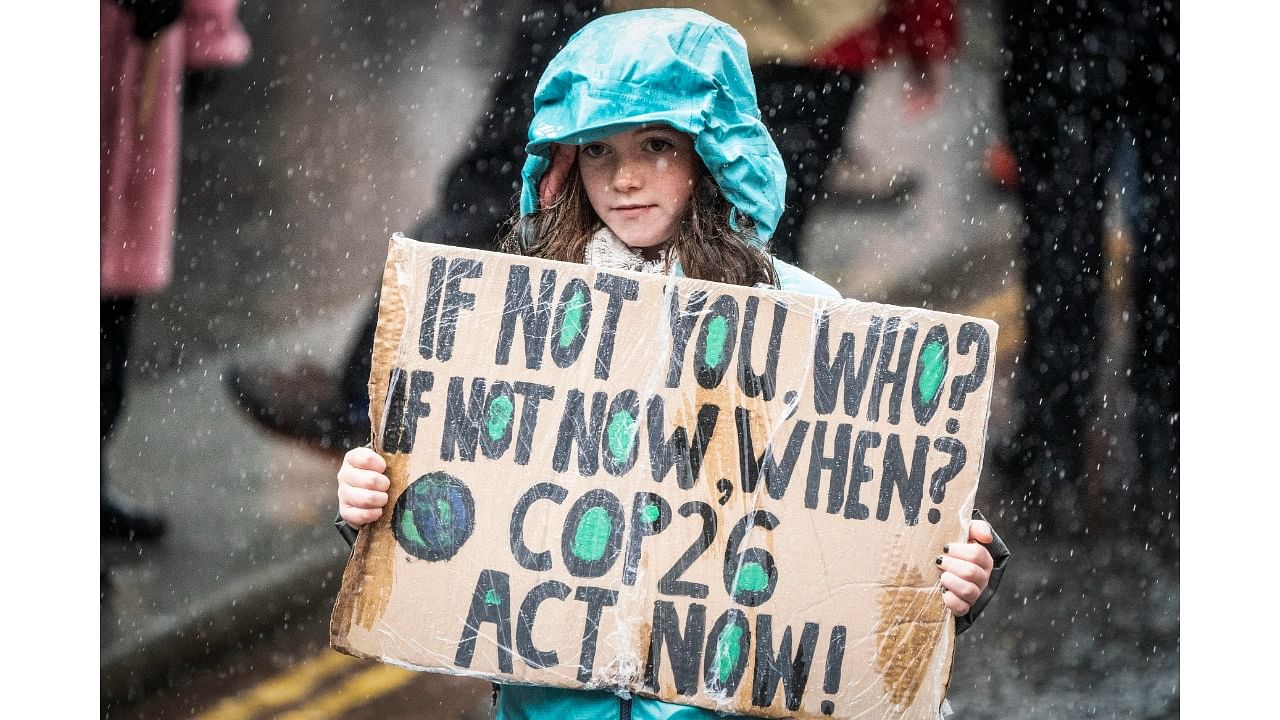 Protesters take part in a rally organised by the COP26 Coalition in Glasgow, Scotland, demanding global climate justice, Saturday, November 6, 2021. The protest was taking place as leaders and activists from around the world were gathering in Scotland's biggest city for the UN climate summit, to lay out their vision for addressing the common challenge of global warming. Credit: AP/PTI Photo