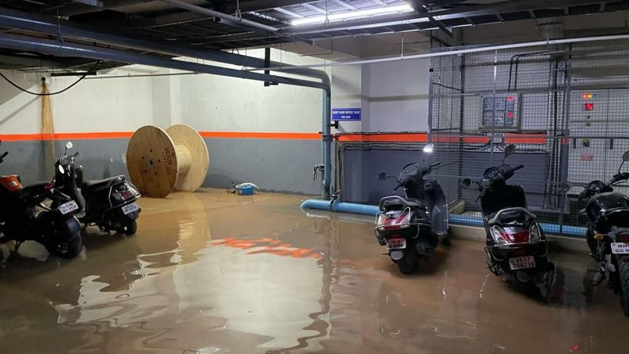 An image of the flooded basement at Prestige Kew Gardens in Bellandur where the freshwater sump and sewage water drain (located next to each other) are underwater with an unknown source of muddy water jetting from the  left wall over the freshwater sump. Credit: Special arrangement