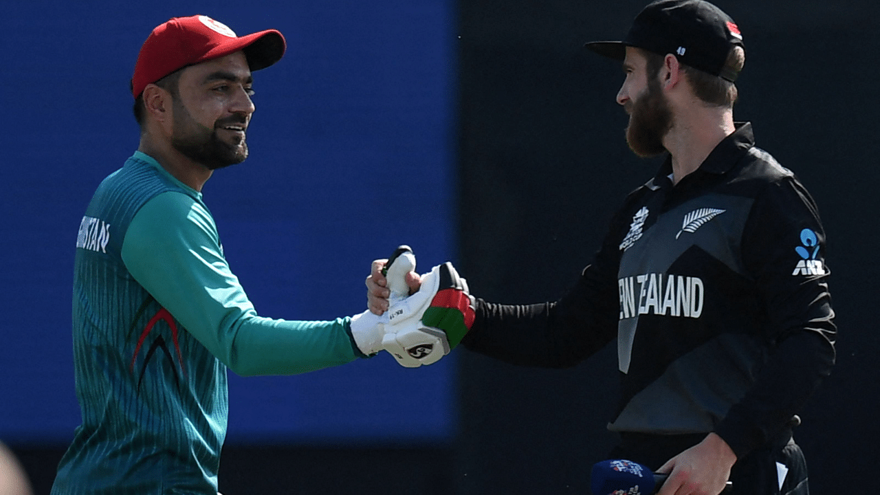 Afghanistan's Rashid Khan (L) greets New Zealand's captain Kane Williamson before the start of the ICC men’s Twenty20 World Cup cricket match between New Zealand and Afghanistan at the Sheikh Zayed Cricket. Credit: AFP Photo