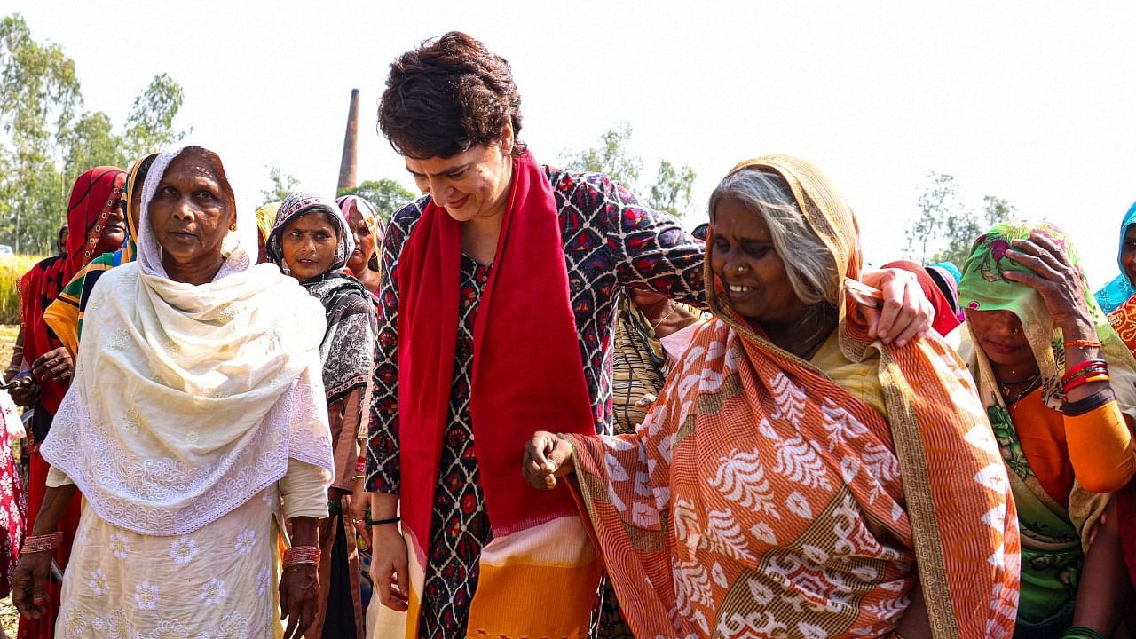 Congress General Secretary Priyanka Gandhi Vadra interacts with women working at a field in Barabanki. Credit: PTI File Photo