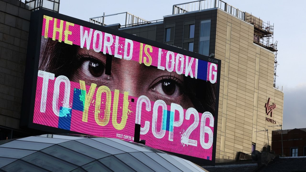 An advertising board is seen during the UN Climate Change Conference (COP26), in Glasgow, Scotland. Credit: Reuters Photo