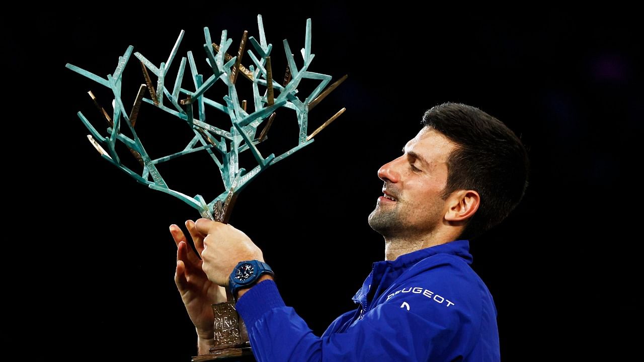 Serbia's Novak Djokovic holds the trophy and celebrates after defeating Russia's Daniil Medvedev 4-6, 6-3, 6-3 in the final of the Paris Masters. Credit: Reuters Photo