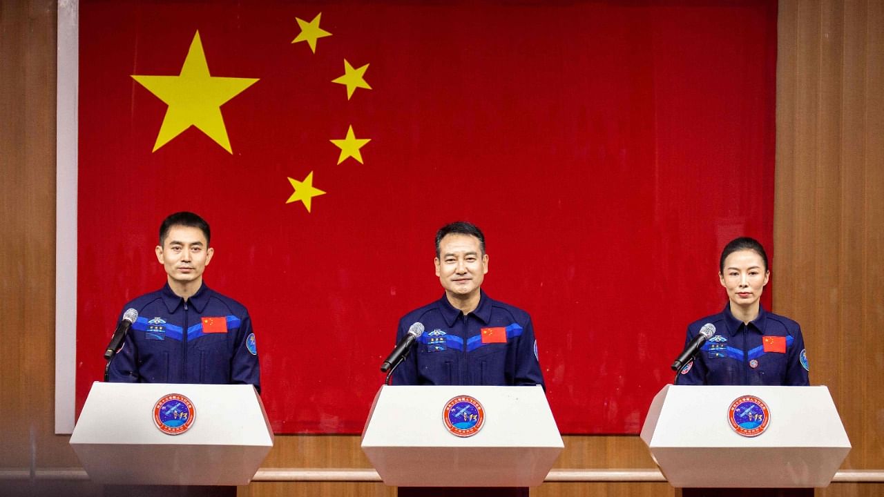 Astronauts Zhai Zhigang (C), Wang Yaping (R) and Ye Guangfu, the second crew for China's new space station. Credit: AFP Photo