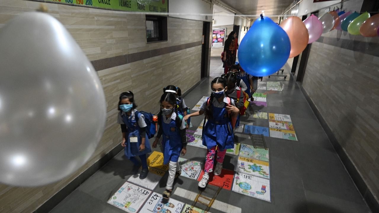 Lobby of a school is decorated with balloons as children resume attending school in New Delhi. Credit: AFP Photo