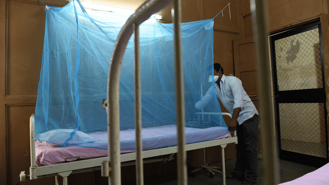 An Indian attendant places a mosquito net to a bed at an isolation ward for Zika Virus patients at Ahmedabad Municipal Corporation run Vadilal Sarabhai (VS) Hospital in Ahmedabad. Credit: AFP Photo