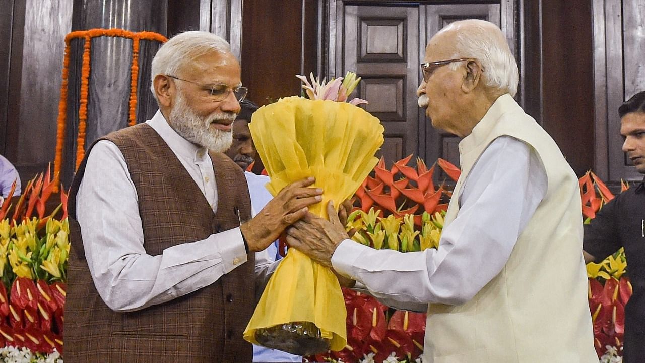 Prime Minister Narendra Modi greets senior BJP leader L K Advani. Credit: PTI File Photo