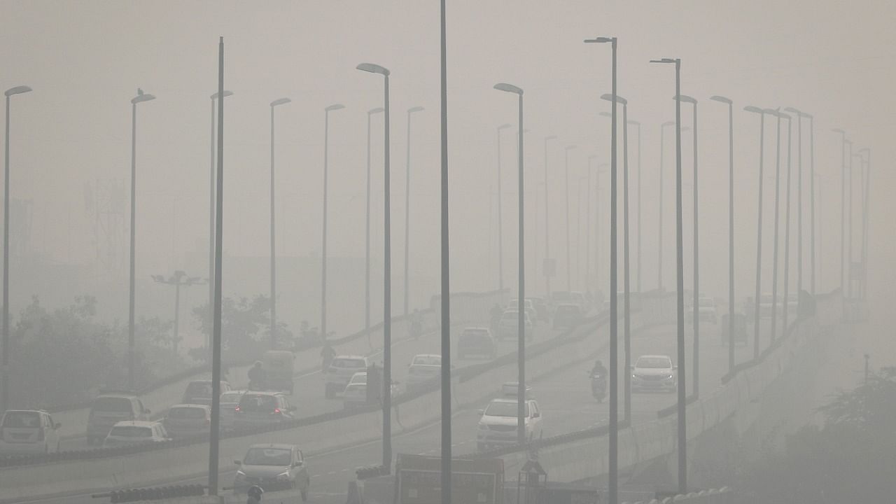 Traffic moves on a flyover on a smoggy morning in New Delhi. Credit: Reuters File Photo