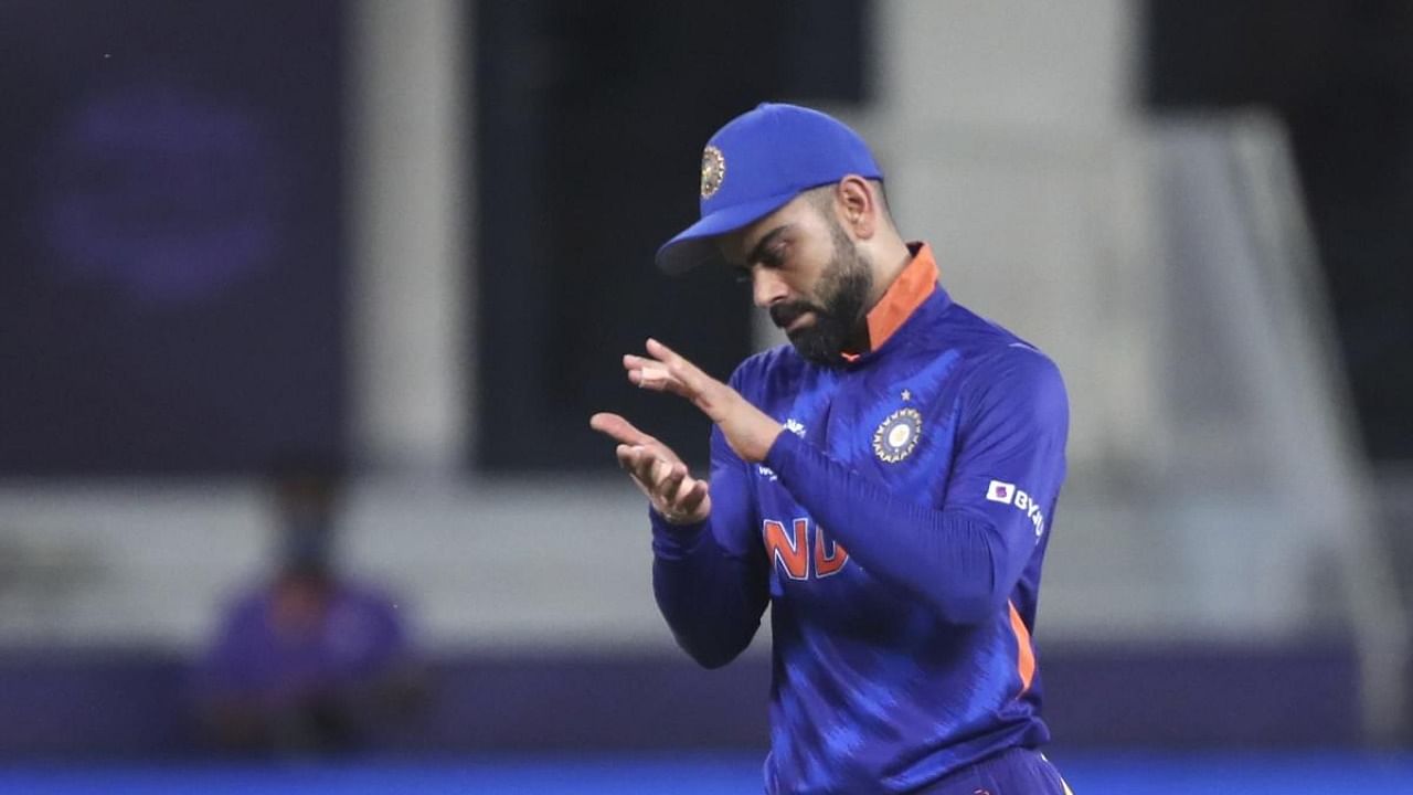 Kohli stepped out in Dubai as T20 skipper for one last time against Namibia. Credit: AP Photo
