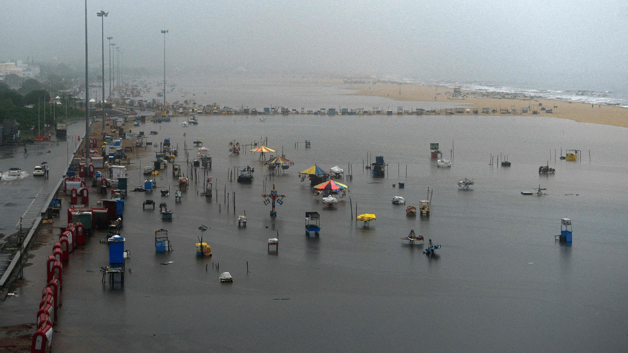 A general view of flooded Marina beach is pictured during a rain shower in Chennai. Credit: AFP Photo