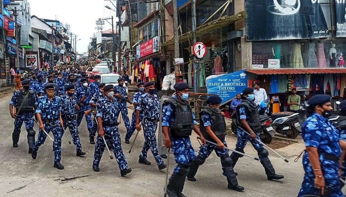 Paramilitary troops conduct a march past in Madikeri on Tuesday.